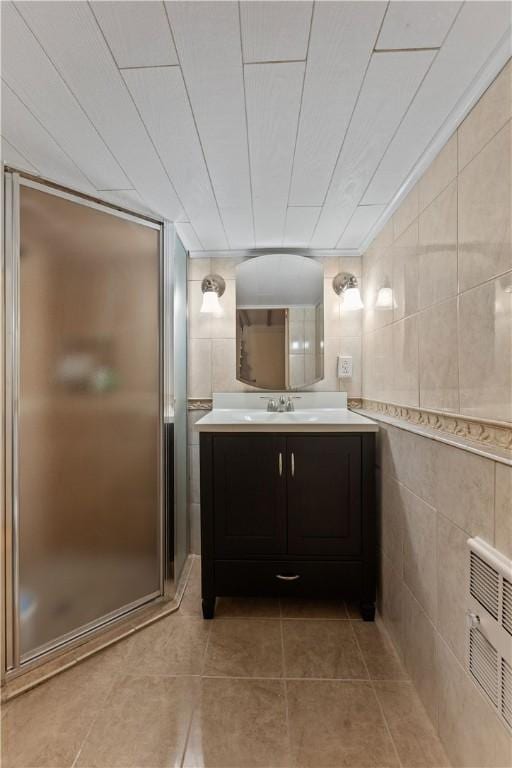 375 Navaho Hollow Rd, Coolbaugh Twp, PA 15438 - bathroom featuring vanity, a shower stall, tile patterned flooring, and heating unit