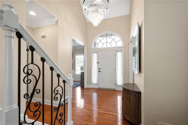 8007 Pressley Ct, Mccandless, PA 15237 - foyer with stairway, wood finished floors, a chandelier, baseboards, and a high ceiling