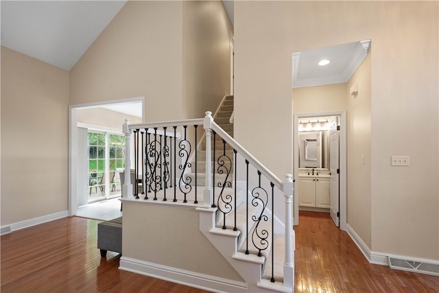 8007 Pressley Ct, Mccandless, PA 15237 - stairway with high vaulted ceiling, wood finished floors, baseboards, and ornamental molding