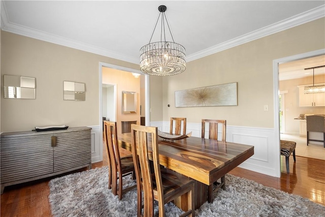 8007 Pressley Ct, Mccandless, PA 15237 - dining area with a chandelier, wood finished floors, crown molding, and a wainscoted wall