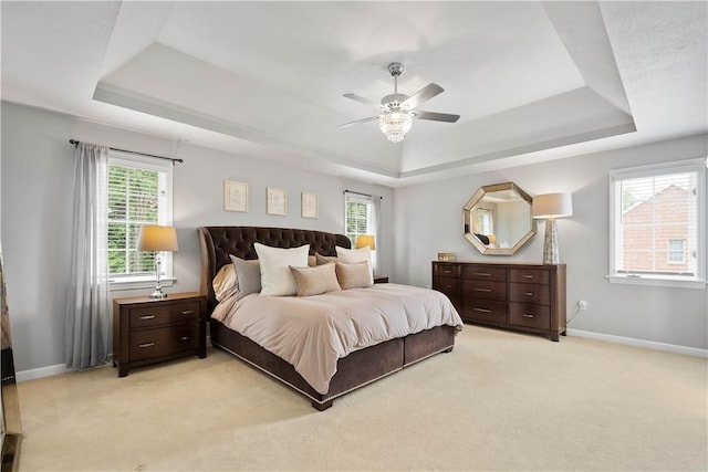 8007 Pressley Ct, Mccandless, PA 15237 - bedroom with a tray ceiling, multiple windows, and baseboards
