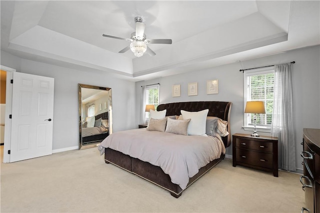 8007 Pressley Ct, Mccandless, PA 15237 - bedroom with a tray ceiling, multiple windows, light colored carpet, and a ceiling fan