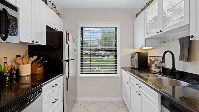 718 Carriage Cir, Pennsbury, PA 15205 - kitchen featuring a sink, white cabinets, dark stone countertops, dishwasher, and baseboards