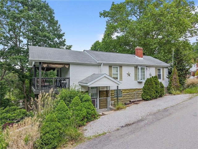 2001 Potomac Ave, Banksville/Westwood, PA 15216 - ranch-style home featuring a chimney, roof with shingles, and stone siding