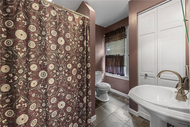 2001 Potomac Ave, Banksville/Westwood, PA 15216 - bathroom with toilet, baseboards, a sink, and a shower with shower curtain