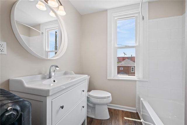 130 Pearl St, Bloomfield, PA 15224 - bathroom with vanity, wood finished floors, toilet, and baseboards