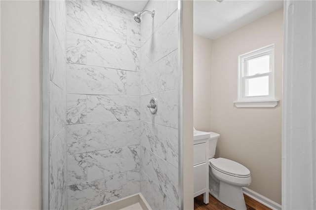 130 Pearl St, Bloomfield, PA 15224 - bathroom featuring a shower stall, wood finished floors, toilet, and baseboards