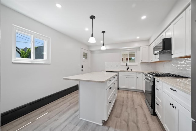 130 Pearl St, Bloomfield, PA 15224 - kitchen with stainless steel gas stove, a sink, healthy amount of natural light, light wood-type flooring, and recessed lighting