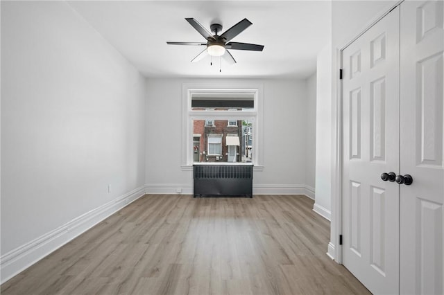 130 Pearl St, Bloomfield, PA 15224 - unfurnished living room featuring light wood-type flooring, baseboards, and ceiling fan