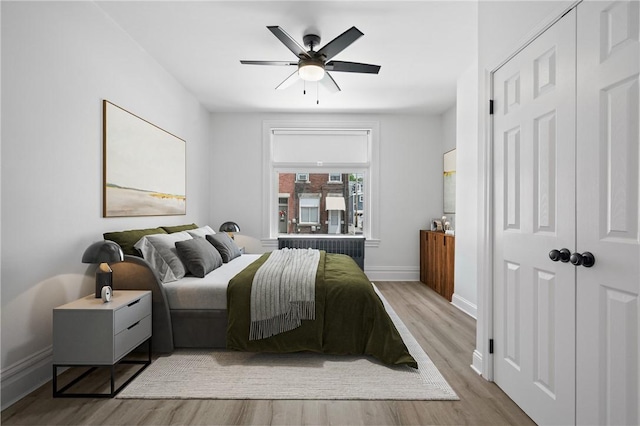 130 Pearl St, Bloomfield, PA 15224 - bedroom featuring wood finished floors, baseboards, and ceiling fan