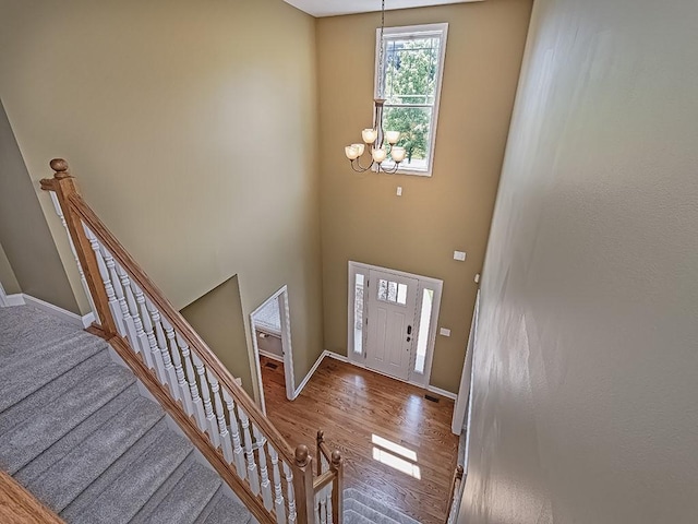 430 Longleaf Dr, Peters Twp, PA 15367 - entrance foyer featuring a chandelier, baseboards, wood finished floors, a towering ceiling, and stairs