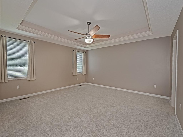 430 Longleaf Dr, Peters Twp, PA 15367 - spare room featuring a raised ceiling, a ceiling fan, carpet flooring, baseboards, and ornamental molding