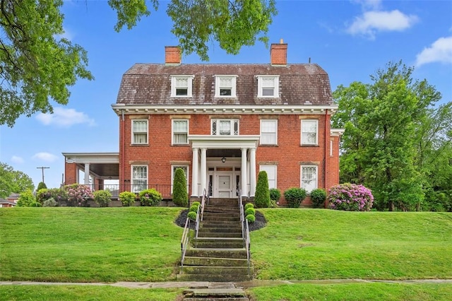 700 Meade St, Monongahela, PA 15063 - view of front of house with a chimney, brick siding, and a front yard