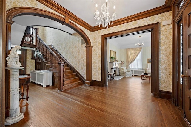 700 Meade St, Monongahela, PA 15063 - foyer with a chandelier, wallpapered walls, stairway, hardwood / wood-style floors, and baseboards