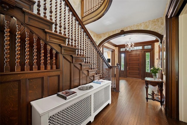 700 Meade St, Monongahela, PA 15063 - entrance foyer with arched walkways, hardwood / wood-style floors, stairway, a chandelier, and wallpapered walls