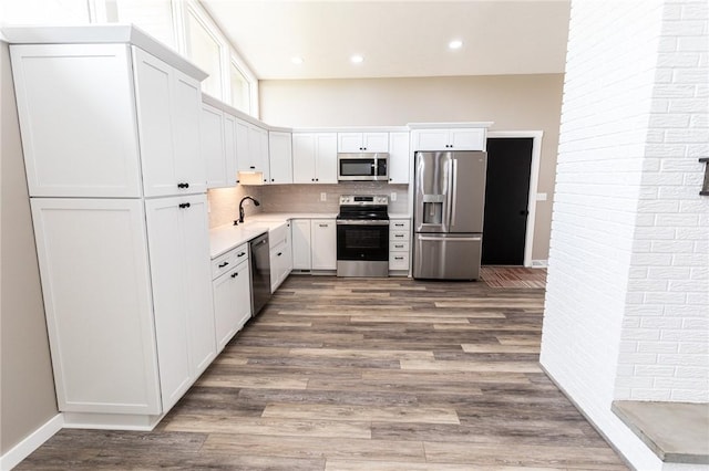 200 Centerwood Cir, South Union Twp, PA 15401 - kitchen with stainless steel appliances, wood finished floors, white cabinets, decorative backsplash, and recessed lighting