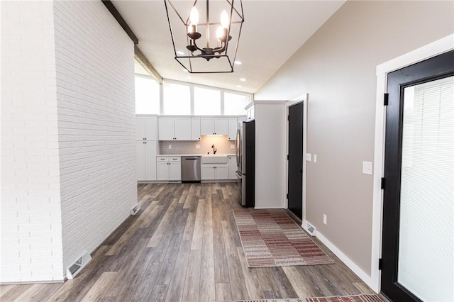 200 Centerwood Cir, South Union Twp, PA 15401 - kitchen with appliances with stainless steel finishes, white cabinets, light countertops, dark wood-style floors, and a chandelier