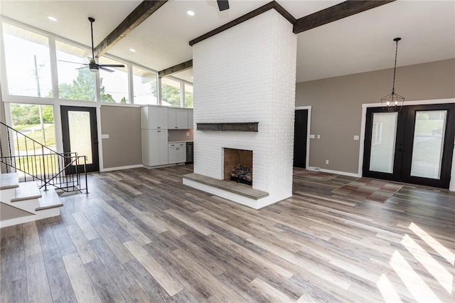 200 Centerwood Cir, South Union Twp, PA 15401 - unfurnished living room featuring beamed ceiling, high vaulted ceiling, baseboards, a ceiling fan, and wood finished floors