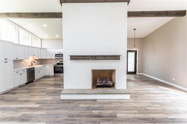 200 Centerwood Cir, South Union Twp, PA 15401 - unfurnished living room featuring beam ceiling, high vaulted ceiling, baseboards, light wood-style flooring, and recessed lighting