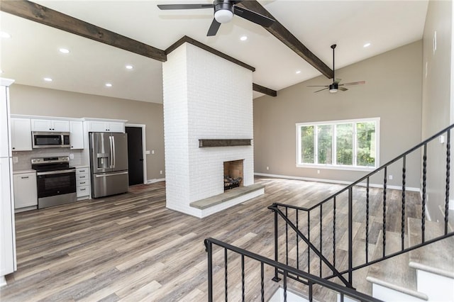 200 Centerwood Cir, South Union Twp, PA 15401 - unfurnished living room featuring ceiling fan, beam ceiling, baseboards, wood finished floors, and high vaulted ceiling