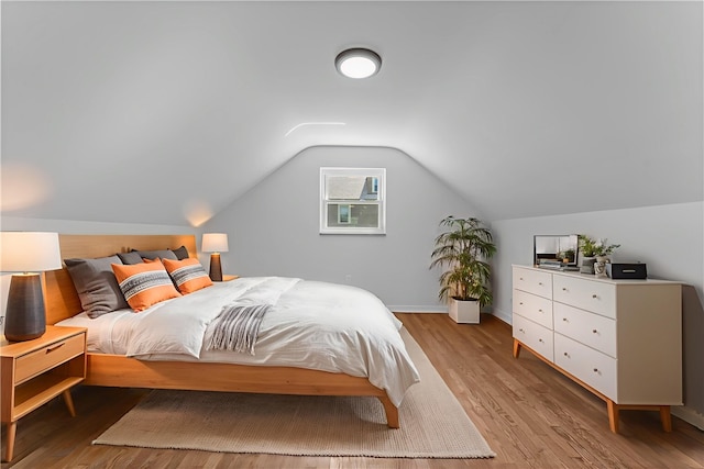 2396 Foster Rd, White Oak, PA 15131 - bedroom with light wood finished floors, lofted ceiling, and baseboards