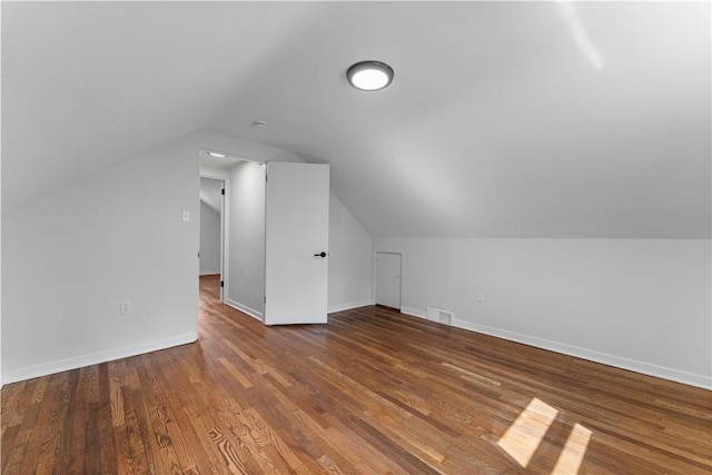 2396 Foster Rd, White Oak, PA 15131 - additional living space featuring vaulted ceiling, baseboards, and wood finished floors