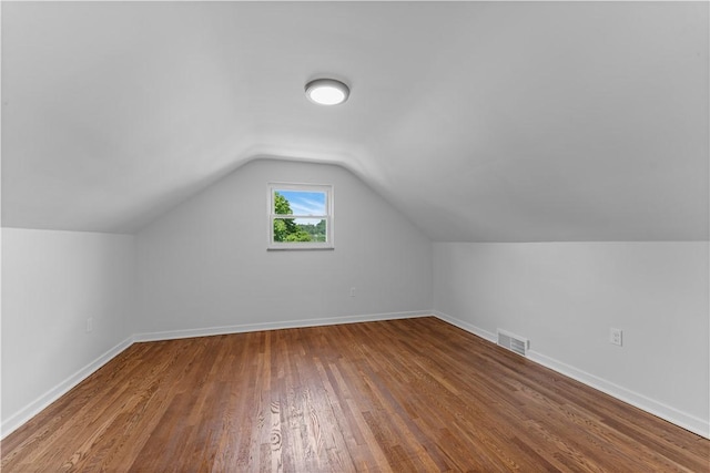 2396 Foster Rd, White Oak, PA 15131 - bonus room featuring wood finished floors, vaulted ceiling, and baseboards