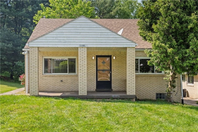 2396 Foster Rd, White Oak, PA 15131 - bungalow-style house featuring brick siding, a front yard, and roof with shingles