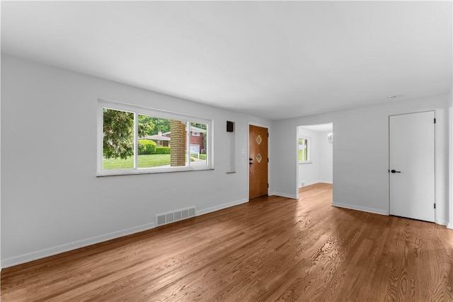 2396 Foster Rd, White Oak, PA 15131 - unfurnished living room featuring wood finished floors and baseboards