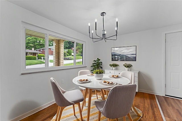 2396 Foster Rd, White Oak, PA 15131 - dining space with a chandelier, baseboards, and wood finished floors