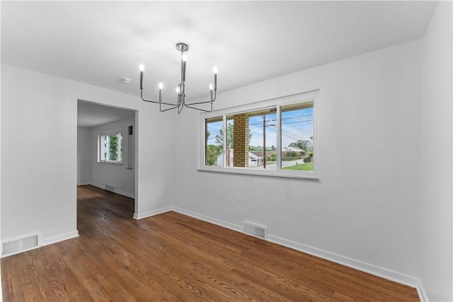 2396 Foster Rd, White Oak, PA 15131 - empty room featuring a chandelier, baseboards, and wood finished floors