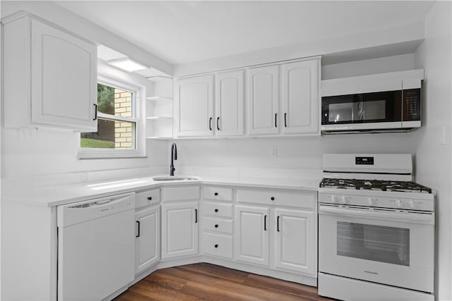 2396 Foster Rd, White Oak, PA 15131 - kitchen with white appliances, a sink, white cabinets, dark wood-type flooring, and light countertops