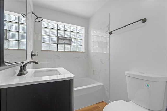 2396 Foster Rd, White Oak, PA 15131 - bathroom featuring toilet, washtub / shower combination, vanity, and wood finished floors