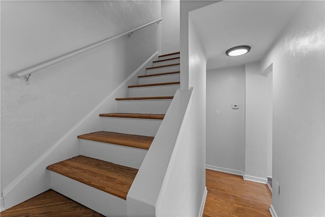 2396 Foster Rd, White Oak, PA 15131 - stairs featuring wood finished floors