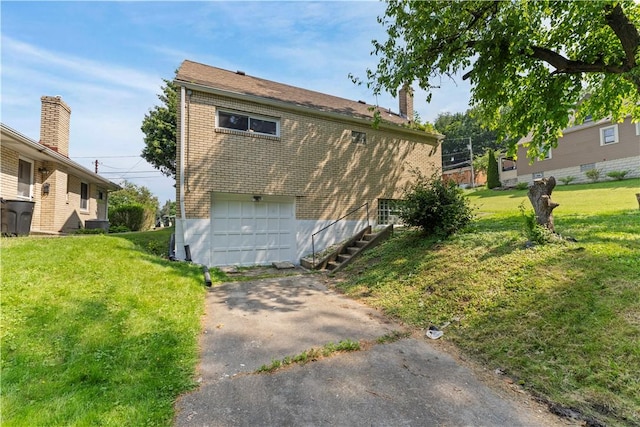 2396 Foster Rd, White Oak, PA 15131 - view of property exterior featuring driveway, an attached garage, brick siding, and a yard