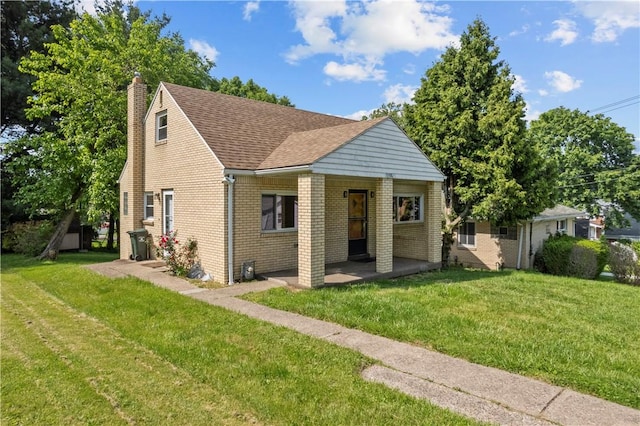 2396 Foster Rd, White Oak, PA 15131 - bungalow featuring a chimney, brick siding, a front lawn, and a shingled roof