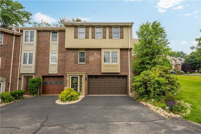 15 Hennig Dr, Whitehall, PA 15236 - multi unit property with a garage, asphalt driveway, and brick siding