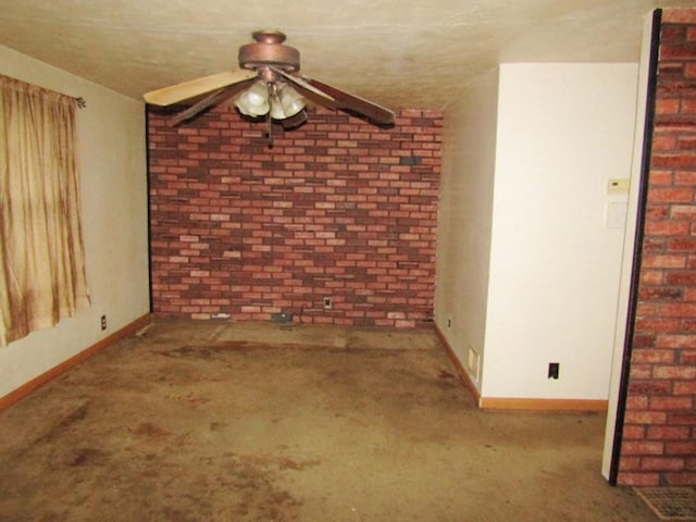 945 Roup Ave, Brackenridge, PA 15014 - spare room with a ceiling fan, carpet floors, baseboards, and brick wall