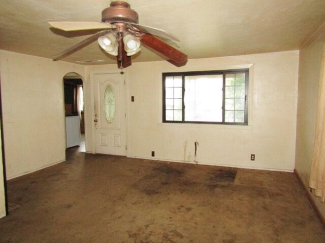 945 Roup Ave, Brackenridge, PA 15014 - spare room featuring a ceiling fan, arched walkways, and carpet flooring