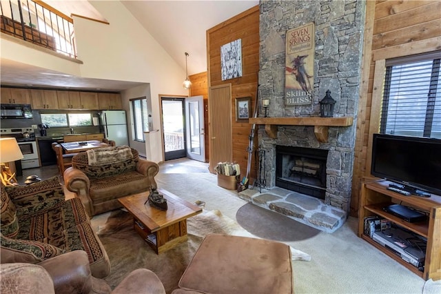 3908 Swiss Mountain Dr, Seven Springs Resort, PA 15622 - living area featuring high vaulted ceiling, carpet flooring, healthy amount of natural light, and a stone fireplace