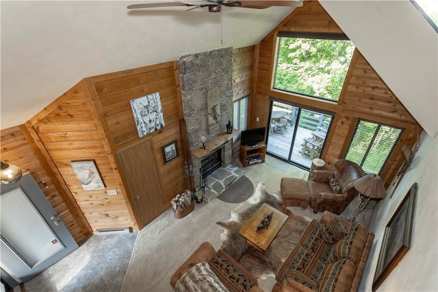 3908 Swiss Mountain Dr, Seven Springs Resort, PA 15622 - living area with wood walls, high vaulted ceiling, a ceiling fan, and a fireplace
