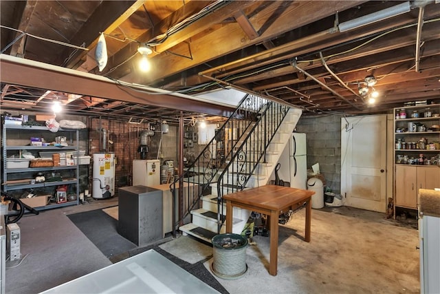 326 Pinevue Dr, Monroeville, PA 15146 - unfinished below grade area featuring water heater, stairs, and freestanding refrigerator
