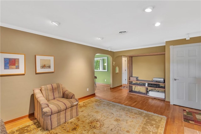 326 Pinevue Dr, Monroeville, PA 15146 - sitting room featuring arched walkways, crown molding, wood finished floors, baseboards, and recessed lighting