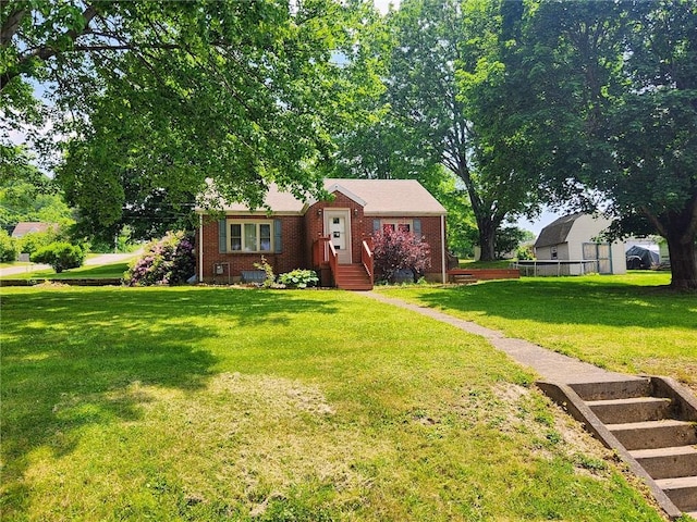 145 7th St, E Butler Boro, PA 16029 - view of front of home featuring brick siding and a front yard