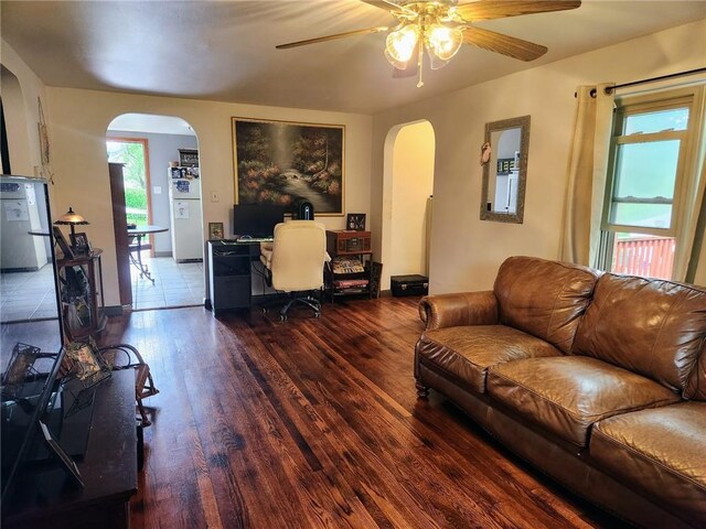 145 7th St, E Butler Boro, PA 16029 - living area with arched walkways, wood finished floors, and ceiling fan