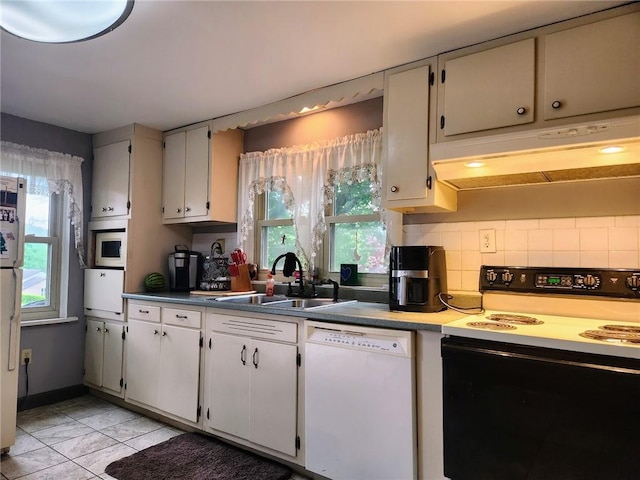 145 7th St, E Butler Boro, PA 16029 - kitchen featuring white dishwasher, electric stove, premium range hood, decorative backsplash, and light tile patterned floors
