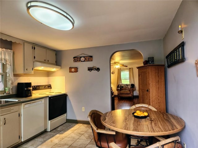 145 7th St, E Butler Boro, PA 16029 - kitchen featuring white dishwasher, range with electric cooktop, under cabinet range hood, arched walkways, and ceiling fan