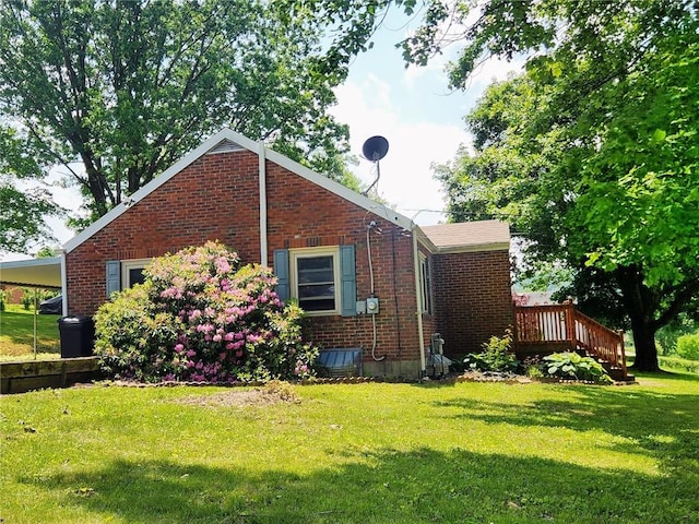 145 7th St, E Butler Boro, PA 16029 - view of side of home featuring brick siding and a lawn