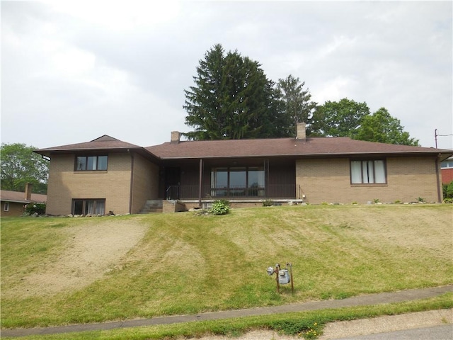 1118 Fairlane Dr, Hopewell Twp Bea, PA 15001 - ranch-style home featuring brick siding, a chimney, and a front yard