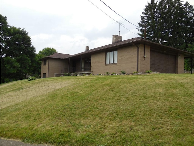 1118 Fairlane Dr, Hopewell Twp Bea, PA 15001 - view of side of property featuring a chimney, brick siding, a lawn, and a garage